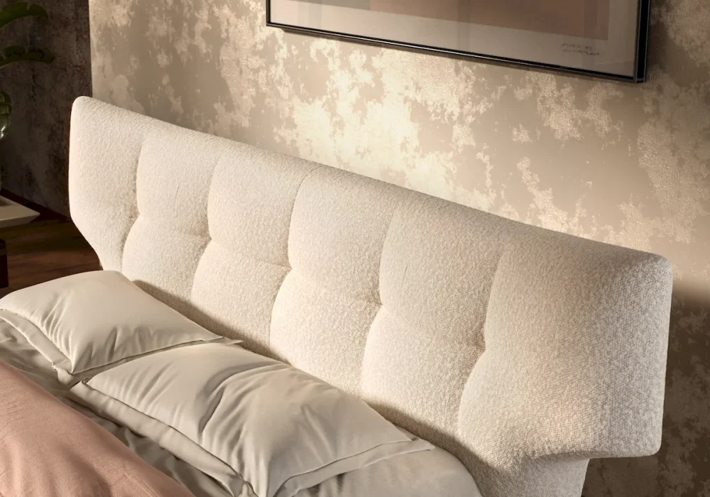 Dettaglio ravvicinato in rendering 3D della testiera trapuntata del letto Thomas Cattelan Italia in tessuto boucle bianco.