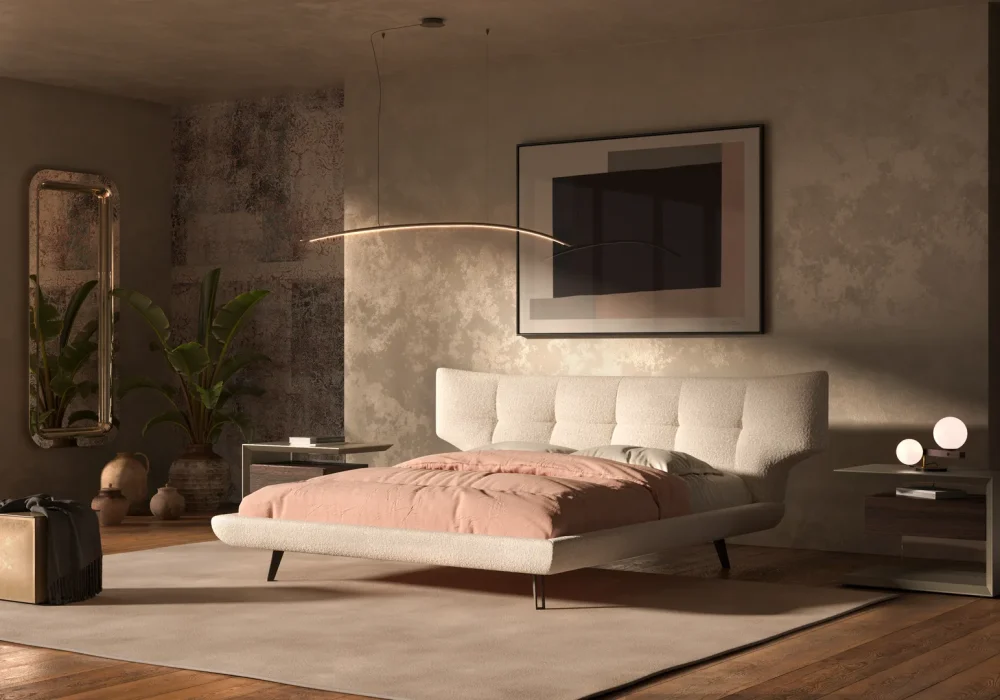Rendering 3D del letto Thomas di Cattelan Italia in tessuto bianco trapuntato con trapunta rosa in un interno di design.